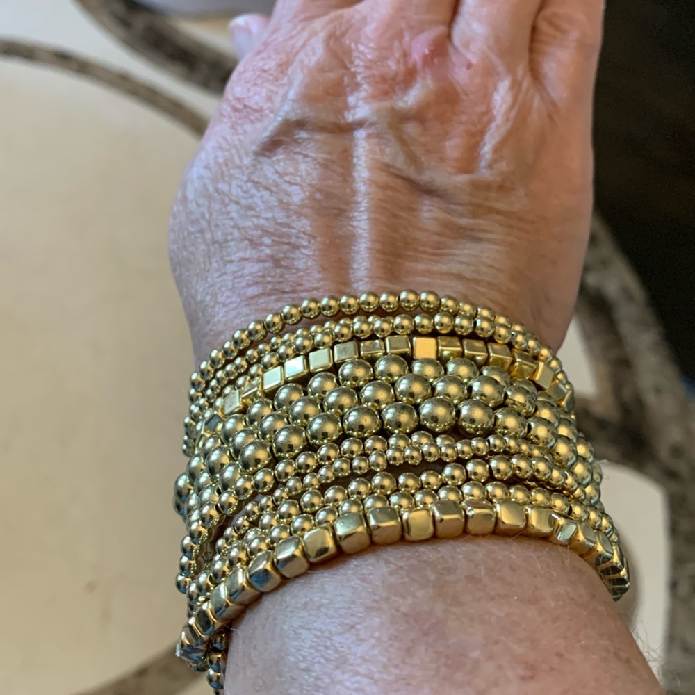 Set of 12 gold tone stretch bracelets